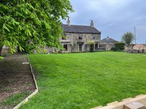 a large yard in front of a house at The Farmhouse in Pontefract