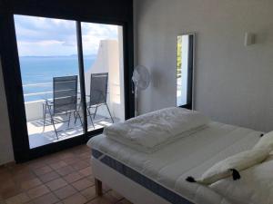 Postelja oz. postelje v sobi nastanitve Joan Timoneda Agradable villa con vistas al mar y 2 parking