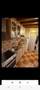a kitchen with a sink and a counter top at Vlado apartments in Podgorica