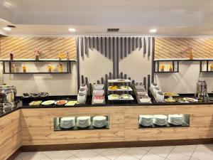 a buffet line with plates of food on display at Sumela Park Hotel in Trabzon