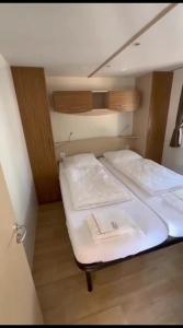 a small room with two beds in it at Mipro mobilhome 6 in Lido di Spina +62 photos