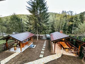 two pavilions in the backyard of a house at Cabana Weekend in Salard