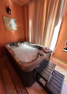 a large bath tub in a room with a window at Luxe apartment / Prime location / 2 bedr- 2.5 bathrooms in Marrakech