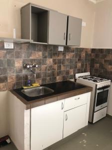 Køkken eller tekøkken på La Comarca Aparts Alojamiento