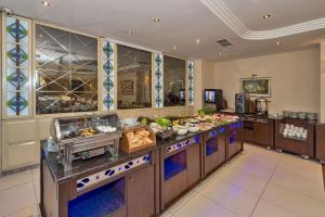 a kitchen with a buffet of food on a counter at Green Anka Hotel in Istanbul +24 photos