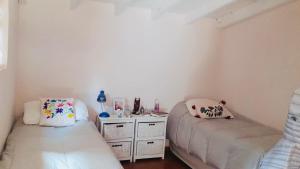 Katil atau katil-katil dalam bilik di Casa en Bariloche