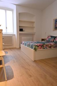Posteľ alebo postele v izbe v ubytovaní Bergamo tra alta e bassa: ST apartments