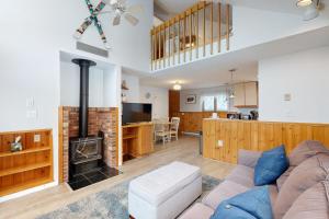 a living room with a couch and a fireplace at Hibernation Station in Thornton