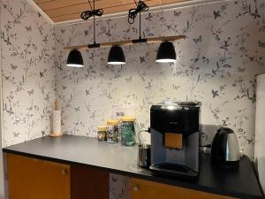 a kitchen with a counter top with a coffee maker at BySannah in Porvoo