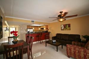 a living room with a couch and a table at Ocean Reef Yacht Club & Resort in Freeport
