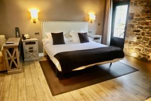Cama o camas de una habitación en Osabarena Hotela