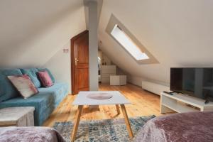 TV a/nebo společenská místnost v ubytování Apartament Esja