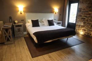 Cama o camas de una habitación en Osabarena Hotela