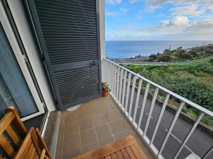 a balcony with a view of the ocean at SAO PEDRO APARTMENT in Santa Cruz