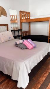 A bed or beds in a room at Pousada Suítes Sete Mares
