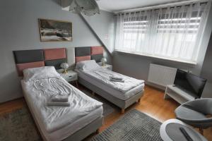 Postel nebo postele na pokoji v ubytování Apartament Esja