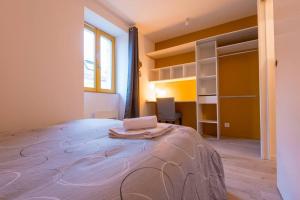 Postel nebo postele na pokoji v ubytování Le petit Lodge