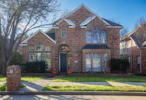 a red brick house with a black door at Elegant Executive Escape 3800 sqft 5 bedroom home in Dallas