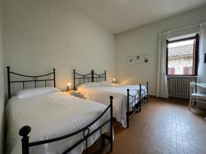 Rúm í herbergi á Monastero SS. Annunziata