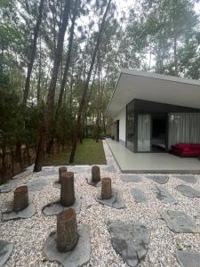 a house in the middle of a forest with trees at Forest Villa at Dai Lai Resort in Ngọc Quang +3 photos