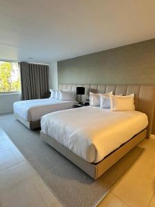 Кровать или кровати в номере Eurobuilding Tama San Cristobal