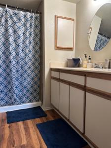 a bathroom with a sink and a shower at Cozy remodeled-condo near TUC Airport & Downtown in Tucson