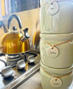 a glass jar with a tea kettle on a stove at North Yorkshire Horse Box in York