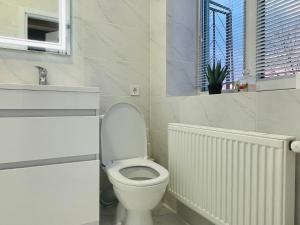 Kúpeľňa v ubytovaní На Куліша 3, сучасні апартаменти біля оперного
