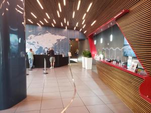 a lobby with a map of the world on the wall at Amazing looking studio 5 min from Ocean near Aventura Mall and Gulfstream casino SPECIAL PROMO INSIDE in Hallandale Beach