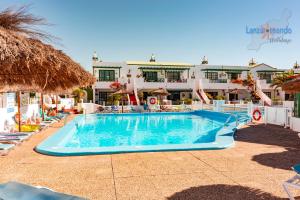 Der Swimmingpool an oder in der Nähe von Vivienda Vacacional Casa Mar y Volcan Vista mar Piscina Playa 5 min Wifi