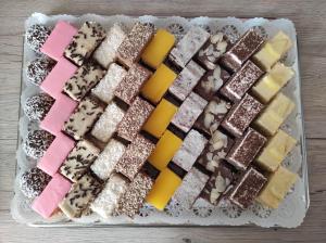 a tray of different types of desserts on a table at Scharfer Kessel in Weimar