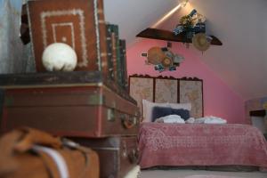 Postel nebo postele na pokoji v ubytování Taty Ginette Maison et Table d'Hôtes