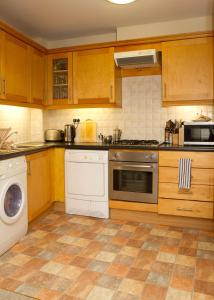 a kitchen with a stove and a dishwasher at Kieran's Place in Dublin