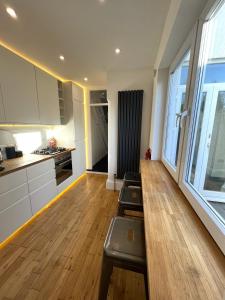 a kitchen with two pilates chairs in a room at Restored Victorian Home with Private Garden in Bristol