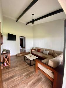 a living room with a couch and a table at Cabaña del Lago in Ajijic