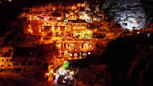 an aerial view of a city at night at Cappadocia Nar Cave House & Swimming Pool in Nevsehir