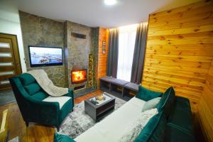 Posezení v ubytování Evergreens houses Zlatibor