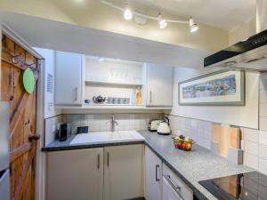 a kitchen with a sink and a counter top at 2 bed in Appledore 80567 in Appledore