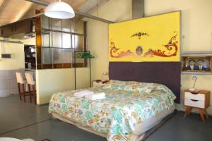 a bedroom with a bed in a room at Casa San Telmo 62 in Buenos Aires