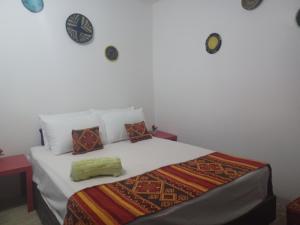 Tempat tidur dalam kamar di Superbe appartement , grande terrasse vue mer et montagne Taghazout