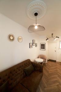 a living room with a couch and a table at Wawahome studio old town in Warsaw