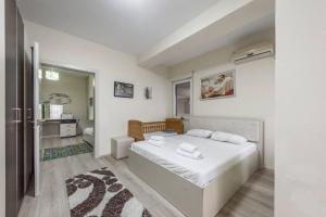 Posteľ alebo postele v izbe v ubytovaní Apartment Shkodra Lake