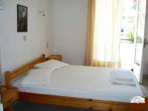 Giường trong phòng chung tại Villa Milos