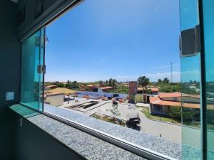 Eco House Gaivota - Cond Ville Portal das Dunas的阳台或露台