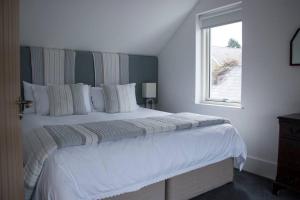 Giường trong phòng chung tại Barn Lane @ Drumagosker Rural Retreats