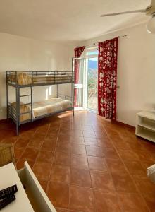 Posteľ alebo postele v izbe v ubytovaní Agriturismo L'Ulivo E Il Mare