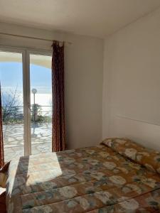 Posteľ alebo postele v izbe v ubytovaní Agriturismo L'Ulivo E Il Mare