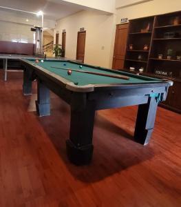 a pool table with balls on it in a room at Hotel Madrid in La Paz