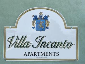 a sign for the villa incantato apartments at Villa Incanto Apartments in Treiso