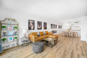 a living room with a couch and a table at Oceanfront Jewel - Remodeled to Perfection in Rehoboth Beach